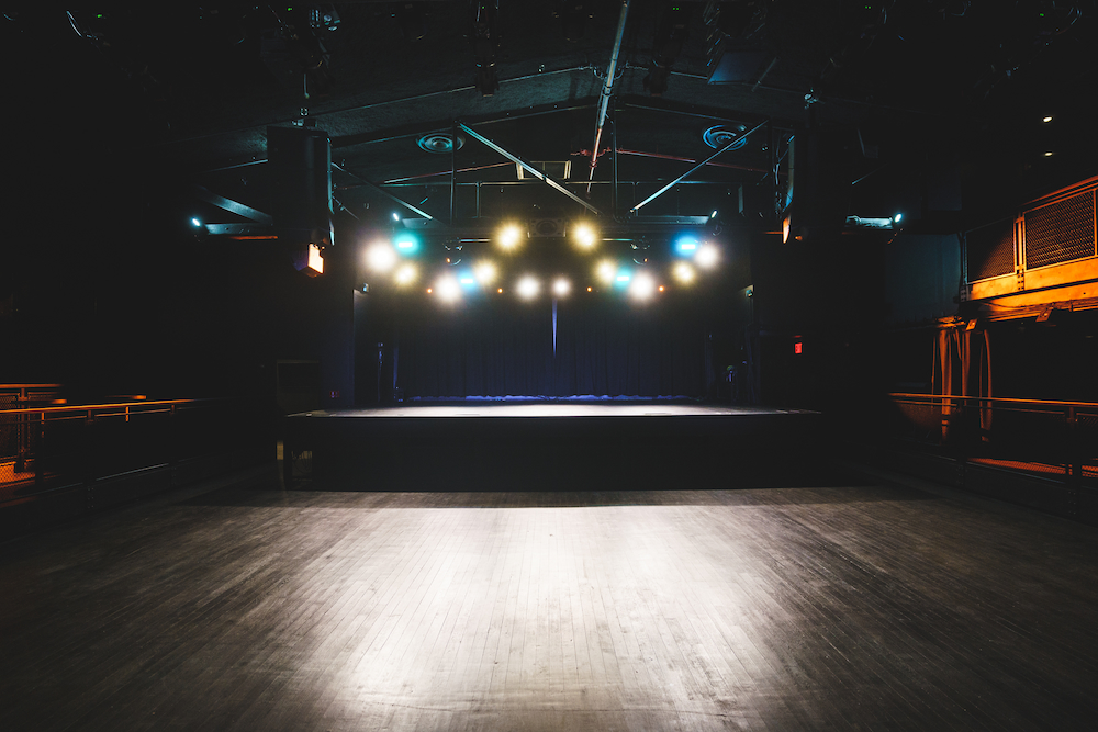 Main Floor in Racket NYC Racket NYC Main Event Space with Fluorescent Lighting and Stage